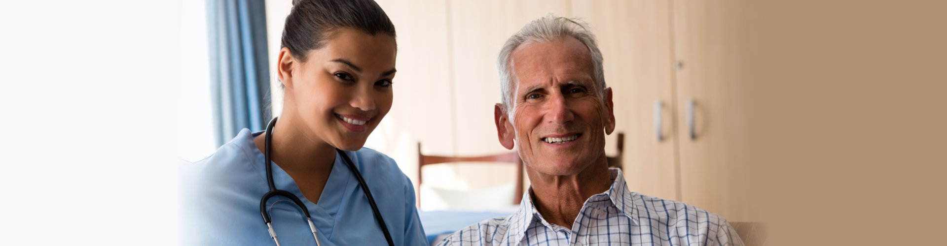 smiling female doctor with senior men sitting in nursing home