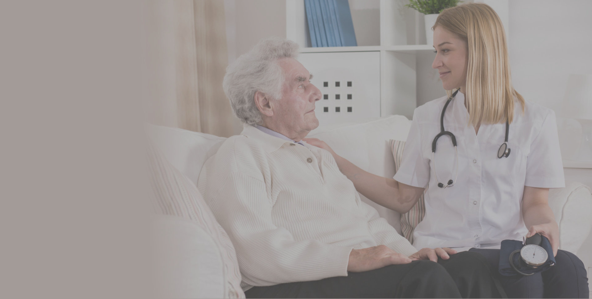 caregiver comforts a senior elderly